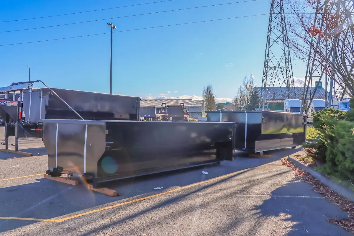 Roll-off dumpster ready for waste disposal at job site for 2 Yard Dumpster Rental in Sanger